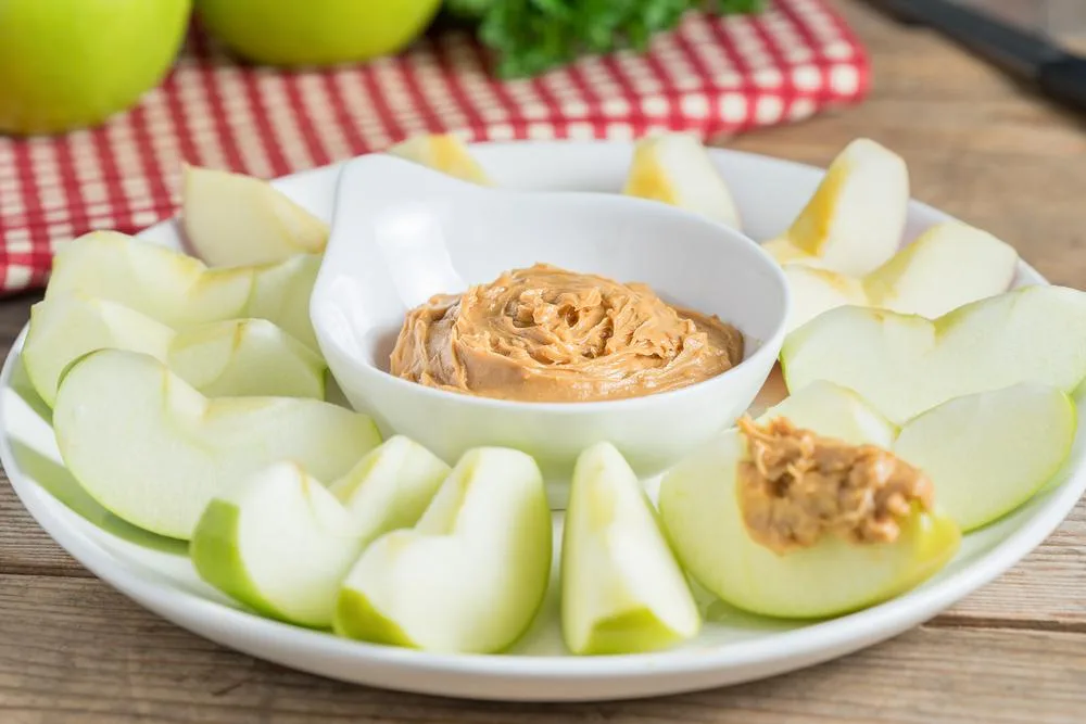 Both peanut butter and apple are loaded with fiber, making them a viable healthy snack
