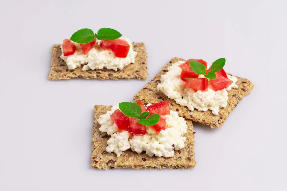 Combining cheese with whole-grain crackers adds additional fiber to aid digestion and reduce hunger.