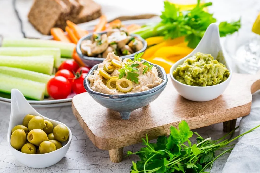Vegetables dipped in hummus is a long-standing healthy snack.
