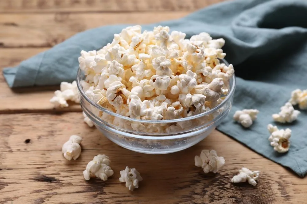 The healthiest version is oil-free air-popped popcorn typically done in a microwave.