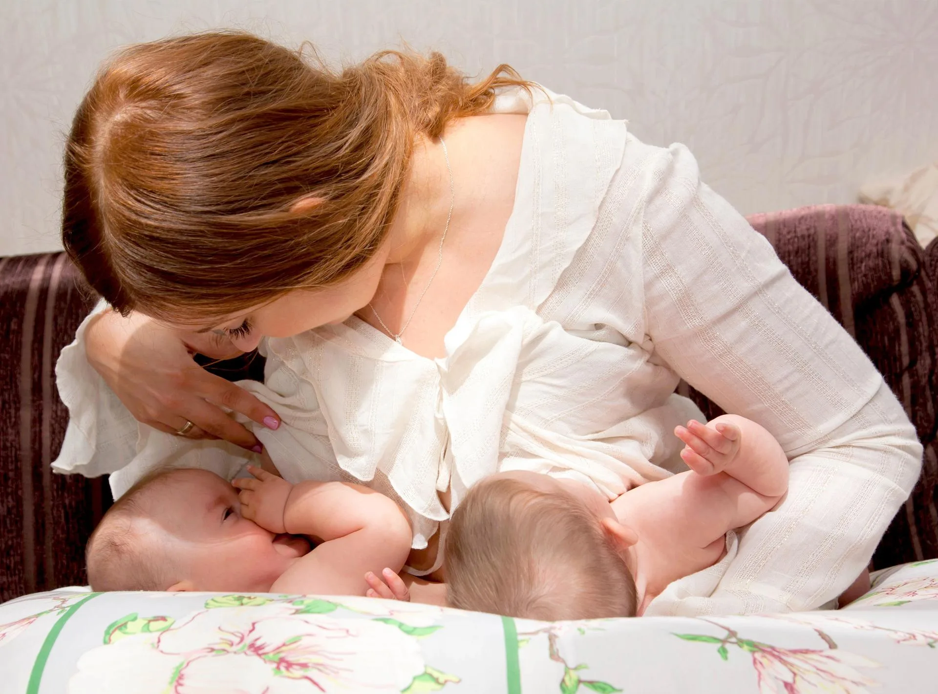 Double Football holds breastfeed